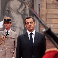 Despite Crisis, Sarkozy Clings to Reform Program