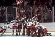 The U.S. men’s hockey team pounces on goalie Jim Craig after a 4-3 victory against the Soviet Union in a medal round match at the the 1980 Winter Olympics in Lake Placid, N.Y., Feb. 22, 1980 (AP file photo).