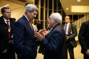 U.S. Secretary of State John Kerry talks with Iranian Foreign Minister Mohammad Javad Zarif in Vienna, Jan. 16, 2016 ( (Kevin Lamarque/Pool via AP).
