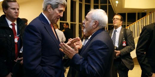 U.S. Secretary of State John Kerry talks with Iranian Foreign Minister Mohammad Javad Zarif in Vienna, Jan. 16, 2016 ( (Kevin Lamarque/Pool via AP).