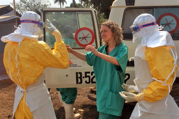 Healthcare workers from Doctors Without Borders prepare isolation and treatment areas for their Ebola operations, Gueckedou, Guinea, March 28, 2014 (AP photo by Kjell Gunnar Beraas).
