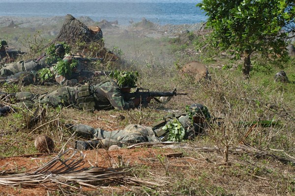 Members of the Armed Forces Philippines (AFP) participate in live-fire exercise while receiving training with the U. S. Army Special Forces, Zamboanga, Philippines, Mar. 21, 2003 (U.S. Navy photo by Petty Officer 1st Class Edward G. Martens).