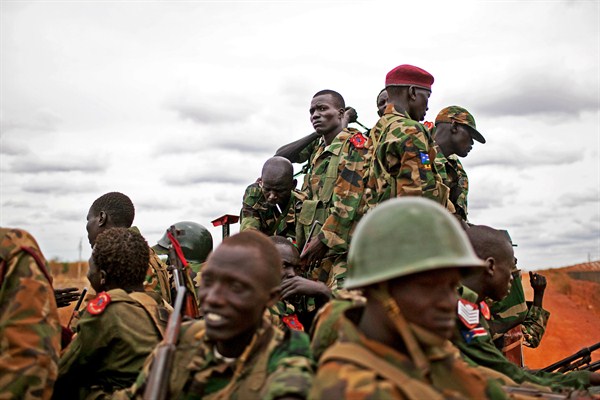 Sudan People's Liberation Army soldiers move toward frontline positions near Pana Kuach, Unity State, South Sudan, May 11, 2012 photo (AP Photo by Pete Muller).