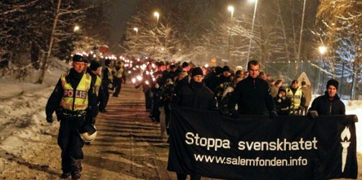 Neo-nazis, rightwing extremists and white supremacists march under police supervision on their annual demonstration in memory of a young skinhead who was killed in 2000, Dec. 11, 2010 (AP Photo by Fredrik Persson, file).