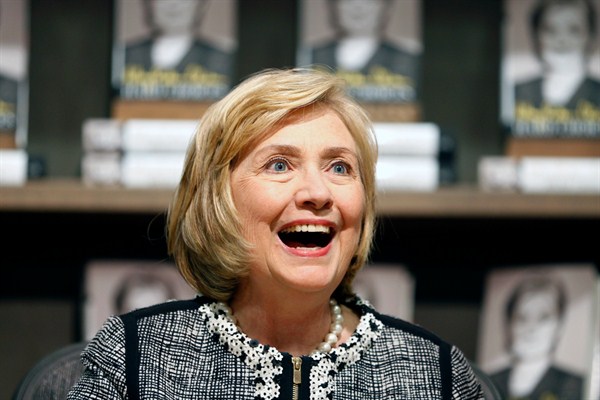 Former Secretary of State Hillary Rodham Clinton as she greets a customer during a book signing of her new book "Hard Choices" at Northshire Bookstore in Saratoga Springs, N.Y, July 29, 2014 (AP Photo/Mike Groll).