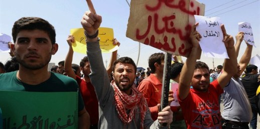 Iraqis from the Yazidi community chant anti-Islamic militants slogans in front of U.N. headquarters to ask for international protection in Irbil, Iraq, Aug. 4, 2014 (AP photo).