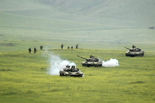 Nagorno-Karabakh soldiers and tanks return to their positions during military exercises outside Stepanakert in Nagorno-Karabakh, April 19, 2006 (AP photo by Karen Minasian).