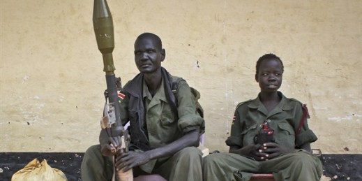 Rebels sit in the now-emptied hospital in Malakal, South Sudan, February 26, 2014 (AP Photo/Ilya Gridneff).