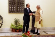 Indian Prime Minister Narendra Modi shakes hand with his Australian counterpart Tony Abbott, New Delhi, India, Sept. 5, 2014 (AP photo by Manish Swarup).