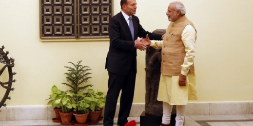 Indian Prime Minister Narendra Modi shakes hand with his Australian counterpart Tony Abbott, New Delhi, India, Sept. 5, 2014 (AP photo by Manish Swarup).