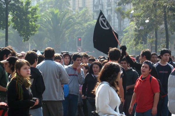 Anarchy flag at a May Day rally, Santiago, Chile, May 1, 2008 (photo by Flickr user cproesser licensed under the Creative Commons Attribution-NonCommerial 2.0 Generic license).