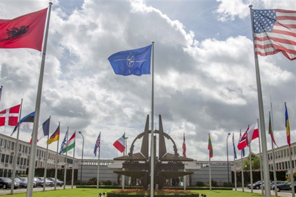 Flags of member nations outside NATO headquarters in Brussels, Aug. 29, 2014 (AP photo by Olivier Matthys).