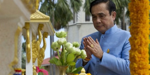Thai Prime Minister Gen. Prayuth Chan-ocha prays in front on the spirit house for good luck, before a meeting in the preparation for his cabinet meeting at the Government house in Bangkok, Thailand, Sept. 9, 2014 (AP photo by Sakchai Lalit).