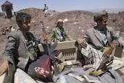Houthi Shiite rebels ride in a pickup truck at the compound of the army’s First Armored Division, after taking it over, Sanaa, Yemen, Sept. 22, 2014 (AP photo by Hani Mohammed).