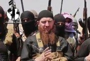 This image made from an undated video shows Tarkhan Batirashvili, known as Omar al-Shishani, among a group of Islamic State fighters (AP Photo/militant social media account via AP video).