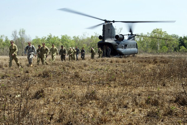 U.S., Australian and Chinese service members disembark from an Australian Army CH-47 Chinook helicopter at a remote landing zone in Northern Territory, Australia, Oct. 12, 2014 (DoD photo by Cpl. Jake Sims, Australian Defense Force).