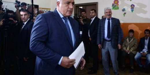 Boyko Borisov, former Bulgarian prime minister and leader of center-right GERB party, holds his voting papers in Sofia, Bulgaria, Oct. 5, 2014 (AP Photo/STR).