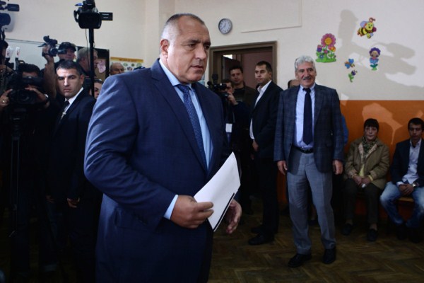 Boyko Borisov, former Bulgarian prime minister and leader of center-right GERB party, holds his voting papers in Sofia, Bulgaria, Oct. 5, 2014 (AP Photo/STR).