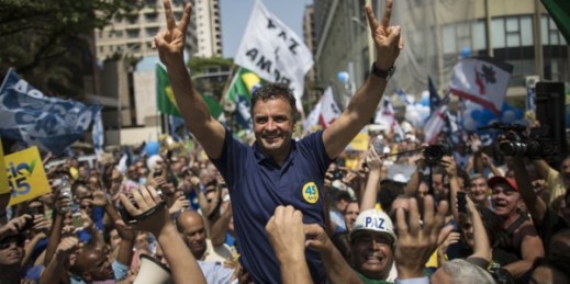 Aecio Neves, Brazilian Social Democracy Party presidential candidate, greets supporters while campaigning at Copacabana beach in Rio de Janeiro, Brazil, Oct. 19, 2014 (AP photo by Felipe Dana).