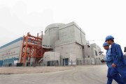 Chinese workers walk past the No.1 reactor at the Ningde Nuclear Power Plant in Ningde city, Fujian province, China, April 18, 2013 (Imaginechina via AP Images).