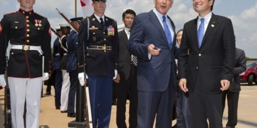 Defense Secretary Chuck Hagel, front left, welcomes Japan’s Defense Minister Itsunori Onodera during an honor cordon at the Pentagon, July 11, 2014 (AP photo by Manuel Balce Ceneta).