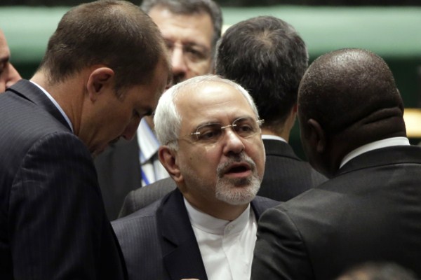 Iranian Foreign Minister Mohamad Javad Zarif talks with diplomats before the start of the 69th session of the United Nations General Assembly, at U.N. headquarters, Sept. 25, 2014 (AP photo by Richard Drew).