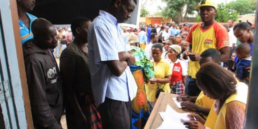 Voters produce identity documents as they go through the voting process at a polling station in Maputo, Mozambique, Oct. 15, 2014 (AP photo by Ferhat Momade).
