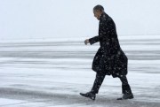 President Barack Obama walks over to greet people after arriving in the snow at Manchester-Boston Regional Airport in Manchester, N.H., March 1, 2012 (AP photo by Susan Walsh).
