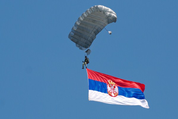 Paratrooper carrrying the Serbian flag, Batanjnica, Serbia, Aug. 2, 2008 (photo by Flickr user jetsetwilly licensed under the Creative Commons Attribution-NonCommercial-ShareAlike 2.0 Generic license).