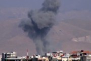 This image taken from video shows heavy shelling by warplanes in the Eastern Ghouta area near Damascus, Syria, Dec. 10, 2012. (AP Photo/Shaam News Network via AP video).