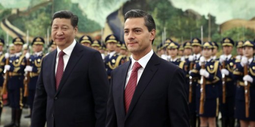 Mexican President Enrique Pena Nieto walks with Chinese President Xi Jinping during a welcome ceremony at the Great Hall of the People in Beijing, Nov. 13, 2014 (AP photo by Andy Wong).