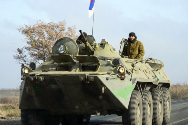 Pro-Russian rebel military vehicle with Russian flag on top of it rolls towards Donetsk, Eastern Ukraine, Nov. 10, 2014 (AP photo by Mstyslav Chernov).