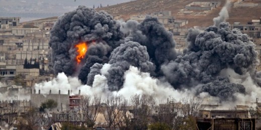 Smoke rises from the Syrian city of Kobani, following an airstrike by the U.S.-led coalition, seen from a hilltop outside Suruc, on the Turkey-Syria border, Nov. 17, 2014 (AP photo by Vadim Ghirda).