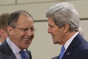 U.S. Secretary of State John Kerry talks with Russian Foreign Minister Sergey Lavrov before the start of the NATO-Russia Council at NATO headquarters in Brussels, Dec. 4, 2013 (AP photo by Pablo Martinez Monsivais, Pool).