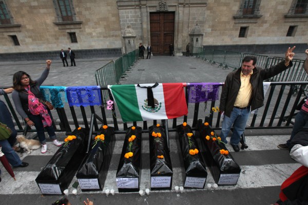 Demonstrators protest the disappearance of 43 students in Ayotzinapa, Mexico City, Nov. 16, 2014 (AP photo by Marco Ugarte).