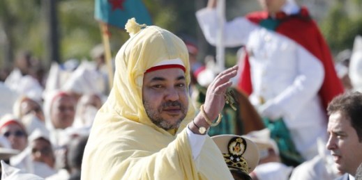 Moroccan King Mohammed VI waves to the crowd as he stands in a limousine during a ceremony of allegiance, at the king’s palace in Rabat, Morocco, July 31, 2014 (AP photo by Abdeljalil Bounhar).