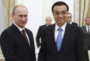 Russian President Vladimir Putin and Chinese Prime Minister Li Keqiang in Moscow, Russia, Oct. 14, 2014. (AP Photo/RIA Novosti, Alexei Nikolsky, Presidential Press Service).