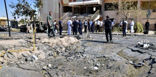 Egyptian security forces inspect the site of a suicide car bombing by Ansar Beit al-Maqdis in the Sinai town of el-Tor, Egypt, Oct. 7, 2013 (AP file photo by Mostafa Darwish).
