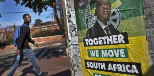A man walks past an election poster of Jacob Zuma’s African National Congress (ANC) party in the Soweto township of Johannesburg, South Africa, May 9, 2014 (AP photo by Ben Curtis).