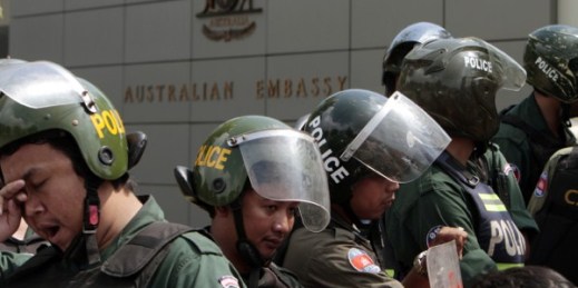 Cambodian riot police officers stand guard in front of Australian Embassy in Phnom Penh, Cambodia, Sept. 26, 2014 (AP photo by Heng Sinith).