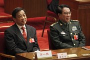 Xu Caihou, right, deputy chairman of the CPC Central Military Commission, and Chongqing Party Secretary Bo Xilai attend the closing session of the National People’s Congress, Beijing, China, March 14, 2012 (AP photo by Vincent Thian).