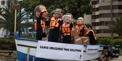 Environmental activists in a boat perform wearing puppet heads representing world leaders during the Climate Change Conference COP20 in Lima, Peru, Dec. 12, 2014 (AP photo by Martin Mejia).
