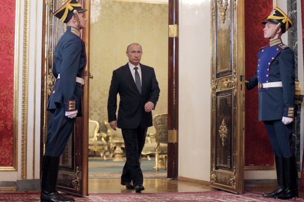 Russian President Vladimir Putin enters a hall for a meeting of the Collective Security Treaty Organization (CSTO) in the Kremlin, Moscow, Dec. 23, 2014 (AP photo by Maxim Shipenkov).