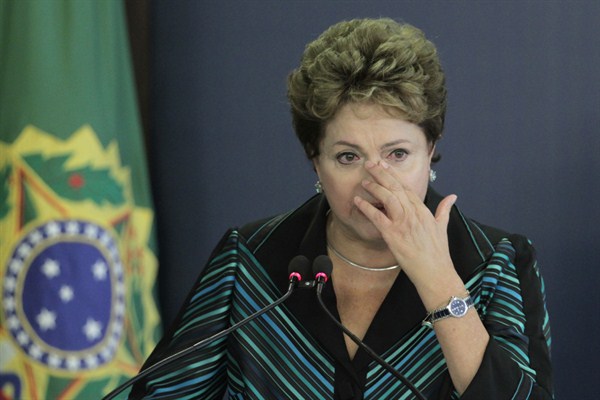 Brazil’s President Dilma Rousseff cries during a speech at the launching ceremony of the National Truth Commission Report in Brasilia, Dec. 10, 2014 (AP photo by Eraldo Peres).