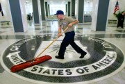 A workman slides a dustmop over the floor at the Central Intelligence Agency headquarters in Langley, Va., March 3, 2005 (AP photo by J. Scott Applewhite).