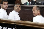 Al Jazeera English producer Baher Mohamed, Canadian-Egyptian acting Cairo bureau chief Mohammed Fahmy and correspondent Peter Greste appear in court during their trial on terror charges, Cairo, Egypt, March 31, 2014 (AP photo by Heba Elkholy).