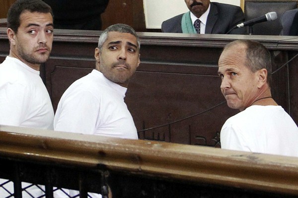 Al Jazeera English producer Baher Mohamed, Canadian-Egyptian acting Cairo bureau chief Mohammed Fahmy and correspondent Peter Greste appear in court during their trial on terror charges, Cairo, Egypt, March 31, 2014 (AP photo by Heba Elkholy).