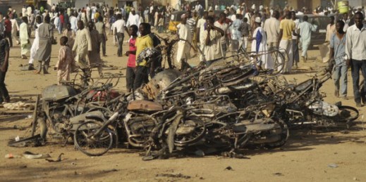 People gather at the site of a bomb explosion, Kano, Nigeria, Nov. 28, 2014 (AP photo by Muhammed Giginyu).