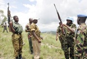 Members of the CNDD-FDD rebel forces surrender their weapons to United Nations Operation in Burundi (ONUB) peacekeepers in Mbanda, southern Burundi, Feb. 3, 2005 (U.N. photo by Martine Perret).