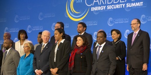 U.S. Vice President Joe Biden speaks to Dominica’s Foreign Minister Francine Baron as they pose for a group photo at the Caribbean Energy Security Summit at the State Department in Washington, Jan. 26, 2015 (AP photo by Jacquelyn Martin).